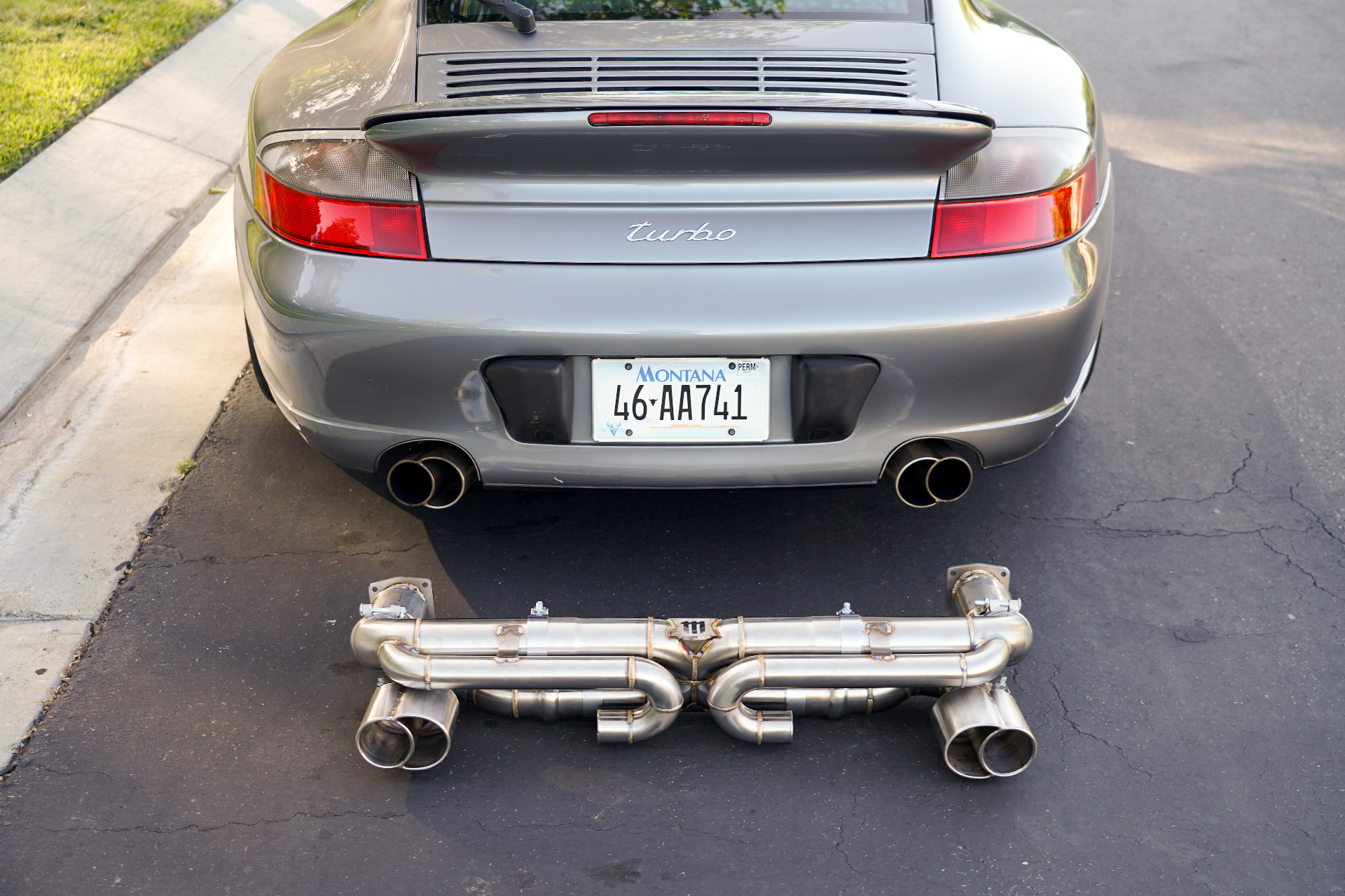 996TT with OEM+ X50 style tips installed next to the titanium X-pipe system